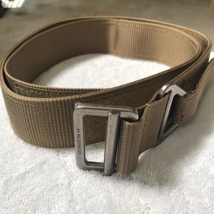 Men’s Wolf tactical tan belt size medium. Fits size 32”-38”.
